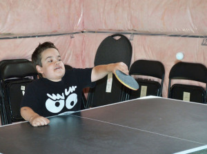 Stefan Gacic shows the leaps of progress he’s made with Morquio A by displaying his ping-pong skills. JUSTIN FORD/Special to the Londoner